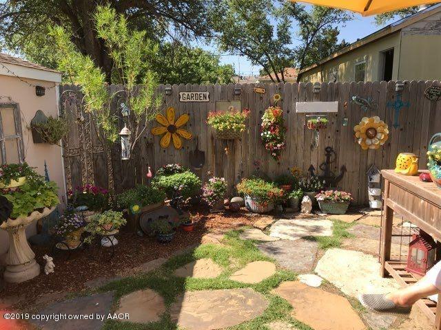 4013 South Travis Street Amarillo, TX 79110 - Photo 25 of 40 a view of a house with a yard