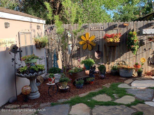 4013 South Travis Street Amarillo, TX 79110 - Photo 28 of 40 a view of a chairs and table in a backyard
