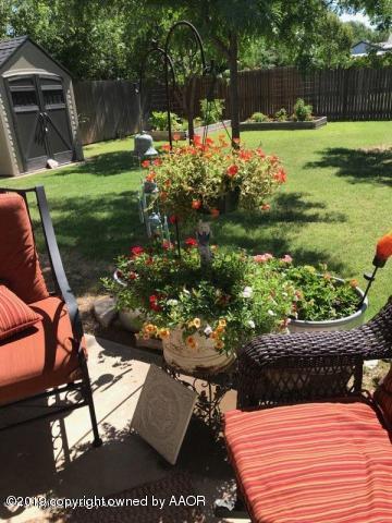 4013 South Travis Street Amarillo, TX 79110 - Photo 4 of 40 a view of a backyard with sitting area