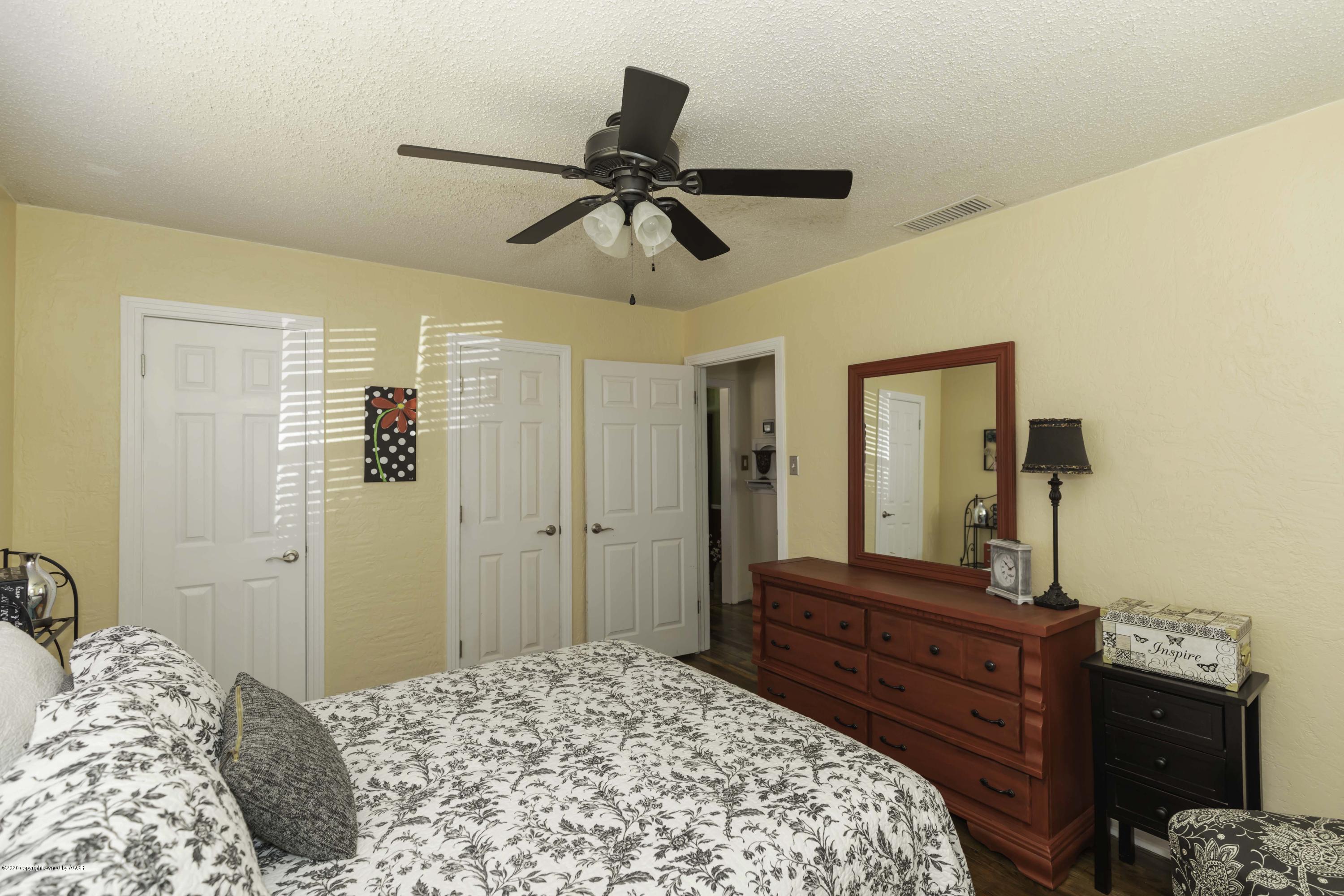 4013 South Travis Street Amarillo, TX 79110 - Photo 34 of 40 a bedroom with a bed and a dresser