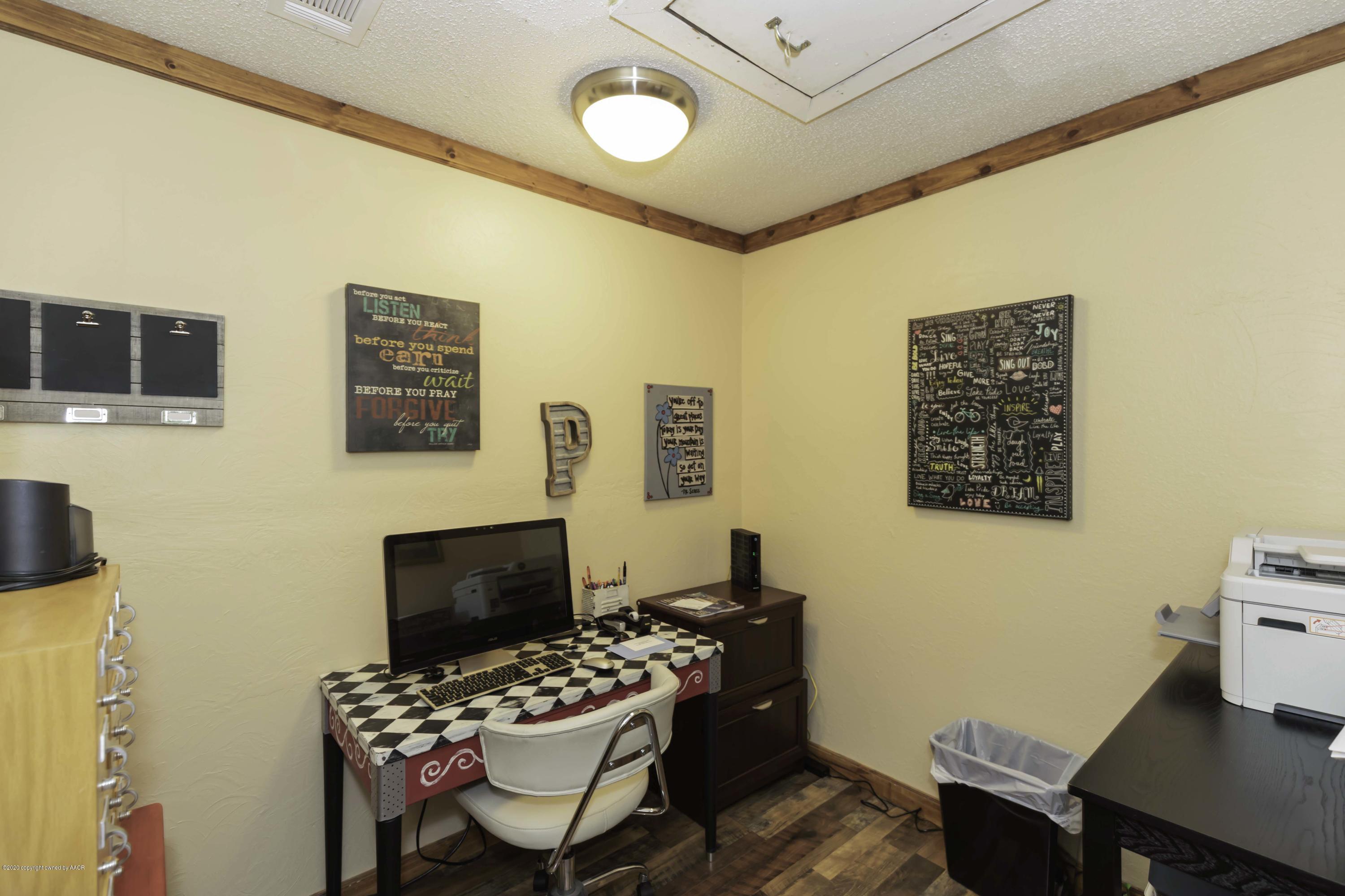 4013 South Travis Street Amarillo, TX 79110 - Photo 39 of 40 a bedroom with a bed and a chair
