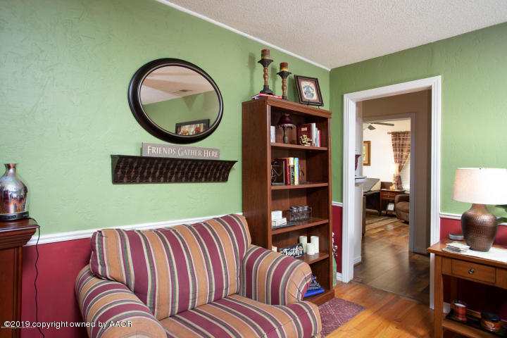 4013 South Travis Street Amarillo, TX 79110 - Photo 8 of 40 a living room with a couch and a table