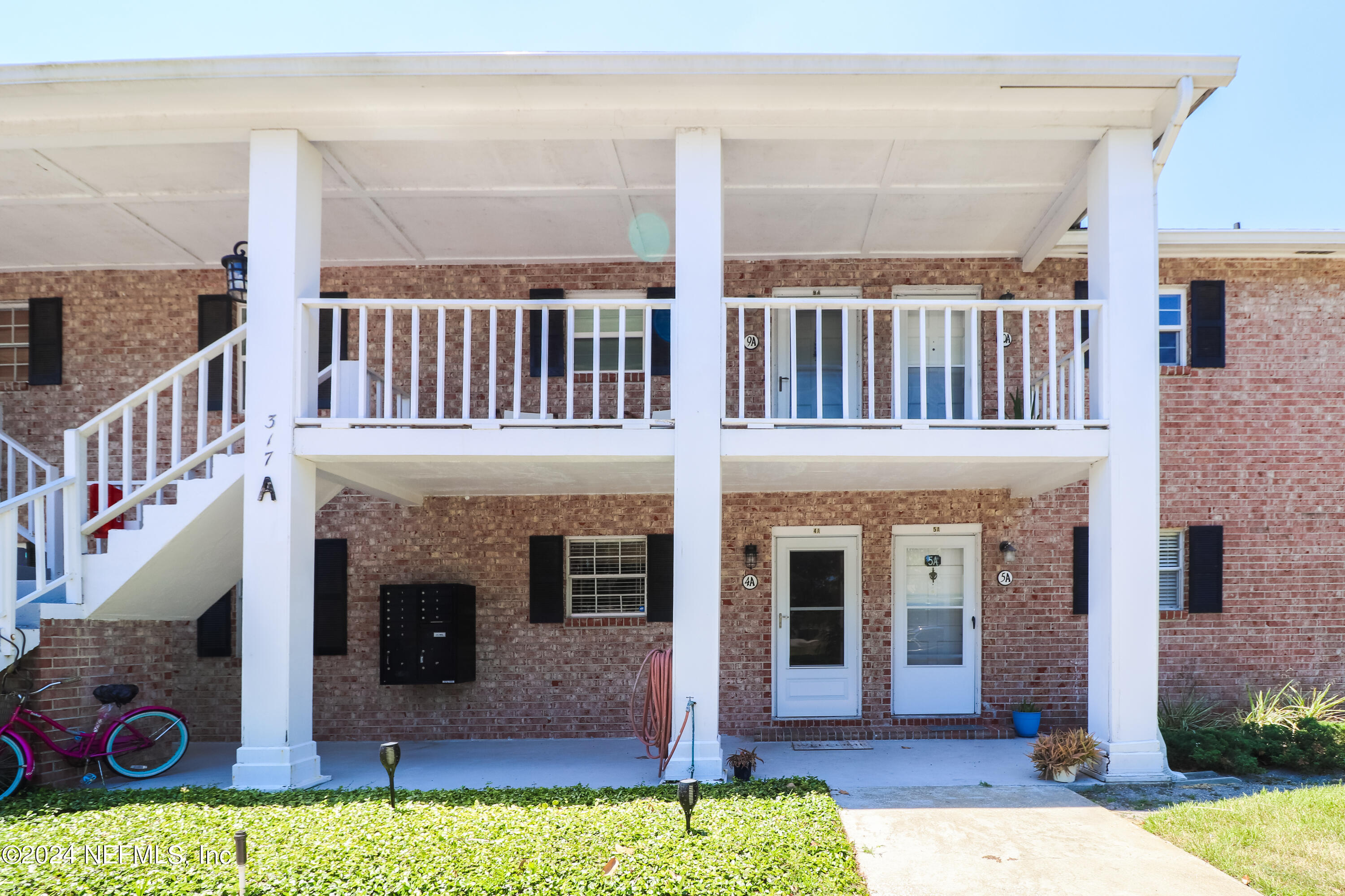 a front view of a house with swimming pool