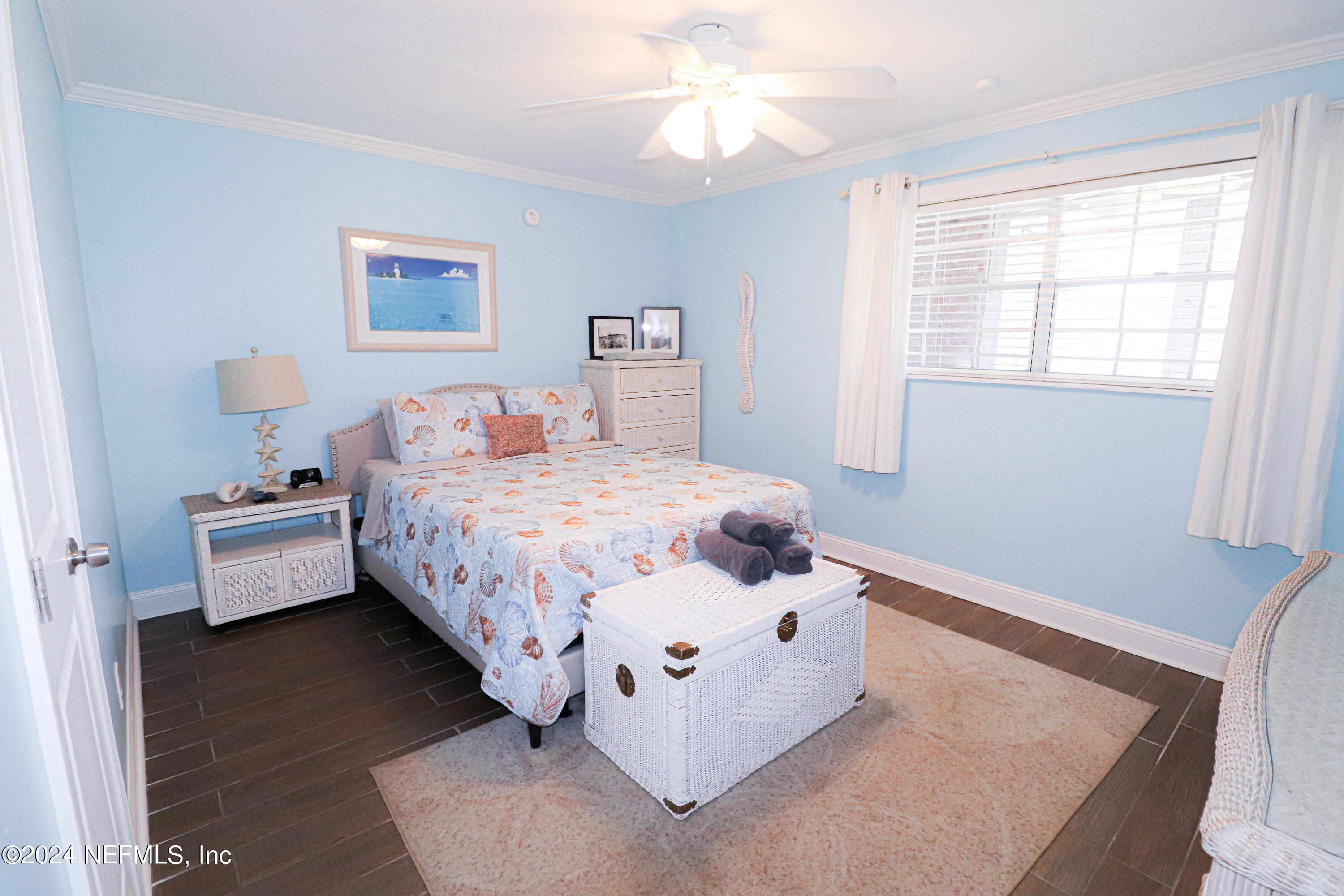 317 Flagler Boulevard, Unit 4A St. Augustine, FL 32080 - Photo 16 of 19 a bedroom with a bed and a large window