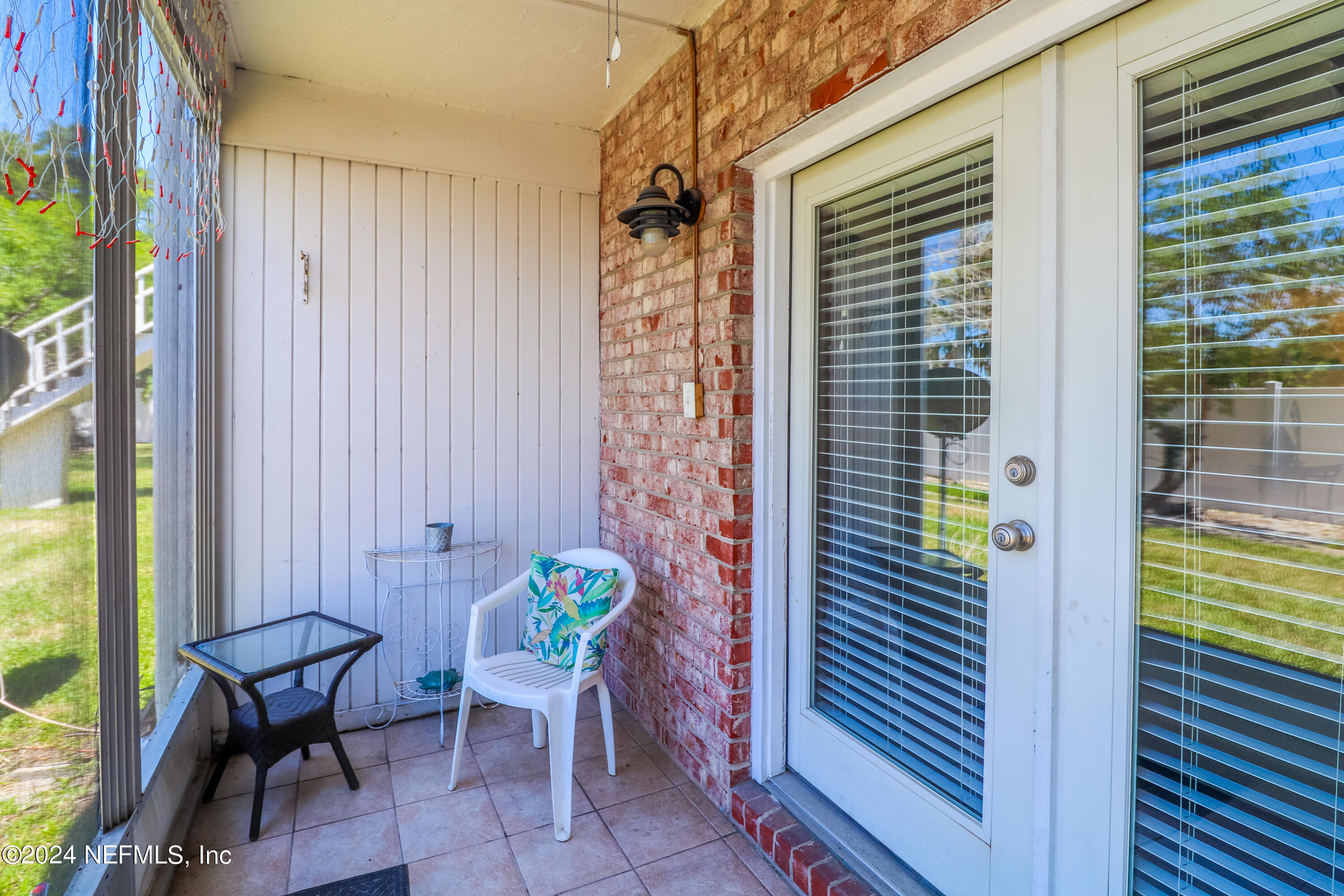 317 Flagler Boulevard, Unit 4A St. Augustine, FL 32080 - Photo 19 of 19 a view of balcony with a table and chairs and potted plants