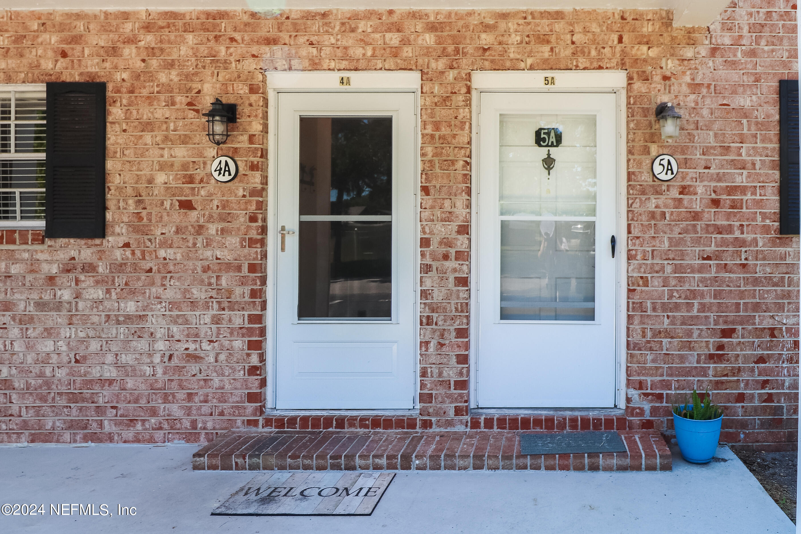 317 Flagler Boulevard, Unit 4A St. Augustine, FL 32080 - Photo 2 of 19 a view of a brick house with an outdoor space