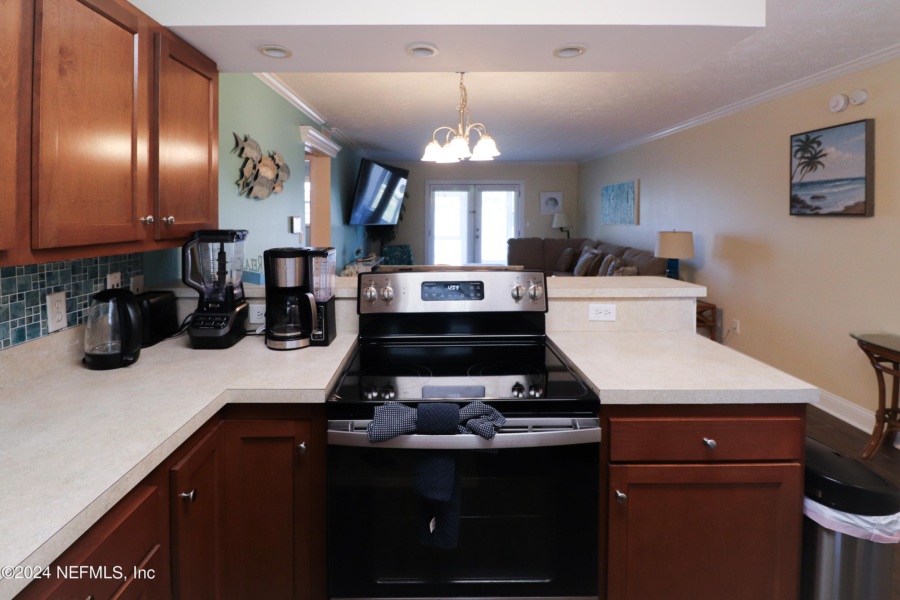 317 Flagler Boulevard, Unit 4A St. Augustine, FL 32080 - Photo 4 of 19 a kitchen with a sink stainless steel appliances and cabinets