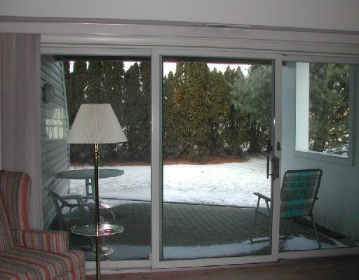 1111 Windward Road Milford, CT 06461 - Photo 1 of 1 a dining room with a glass top table and chairs