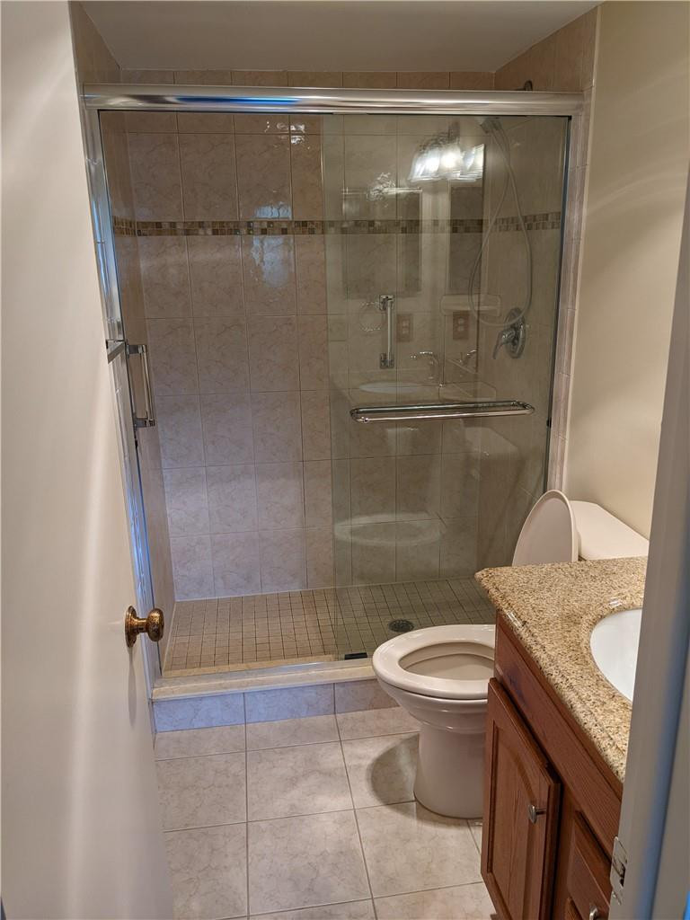 9280 Southwest 3rd Street, Unit 810 Boca Raton, FL 33428 - Photo 7 of 22 a bathroom with a granite countertop sink toilet and shower