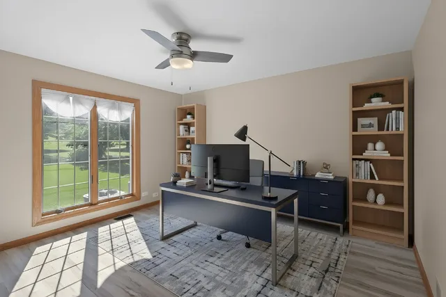 a workspace with furniture and window