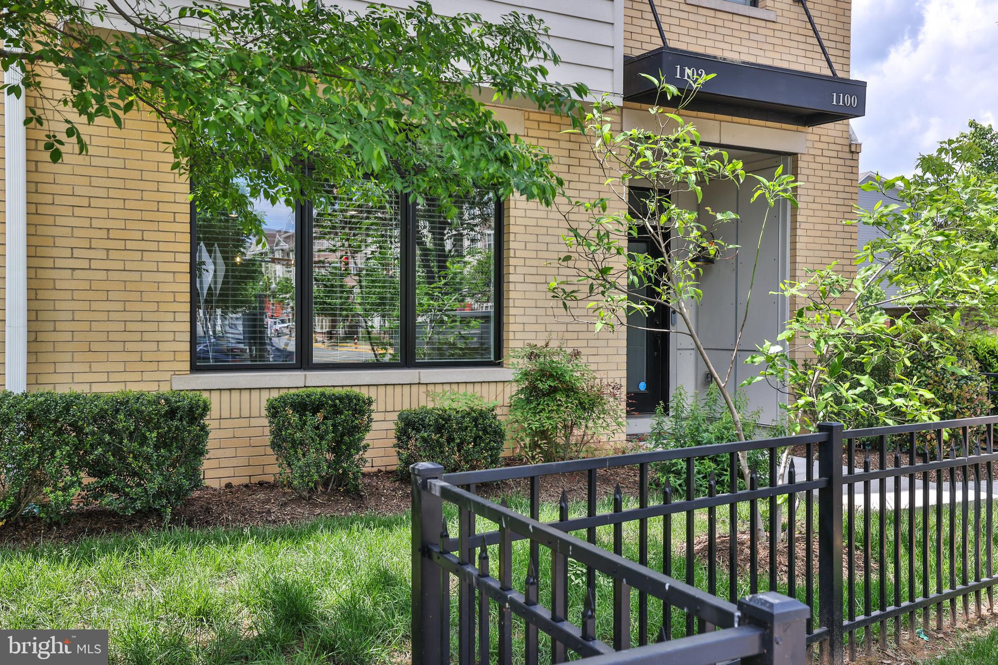 1102 Ribbon Limestone Terrace Southeast Leesburg, VA 20175 - Photo 2 of 51 a view of a house with a small yard and plants
