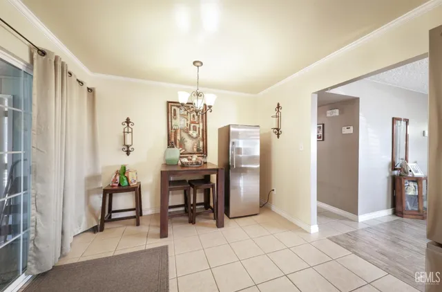 a kitchen with a sink a stove and cabinets