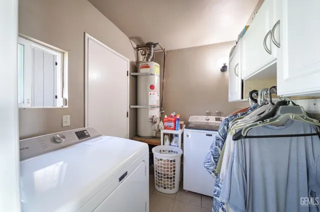 a living room with furniture and a dining table
