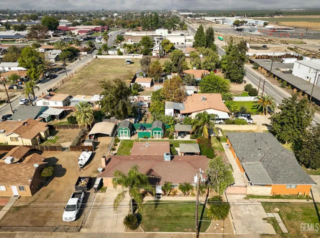 an aerial view of houses with outdoor space