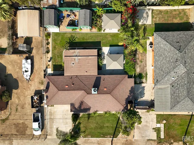 an aerial view of houses with outdoor space