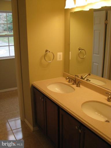 1001 Beech Road Sterling, VA 20164 - Photo 12 of 23 Upper Hall Bath w/ Double Sink & Ceramic Tile