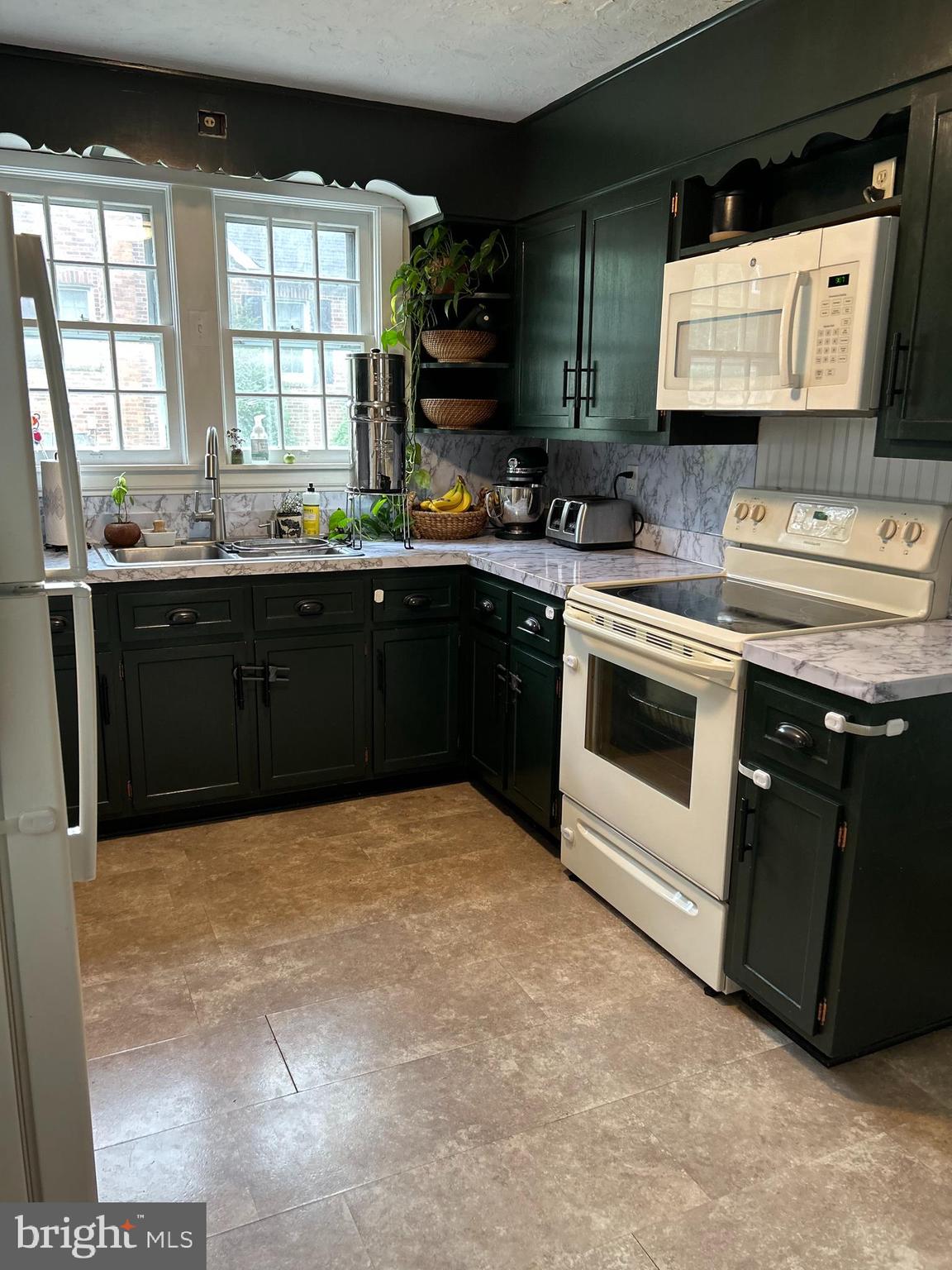 1175 Felton Road Red Lion, PA 17356 - Photo 2 of 16 a kitchen with stainless steel appliances granite countertop a stove a sink and a microwave