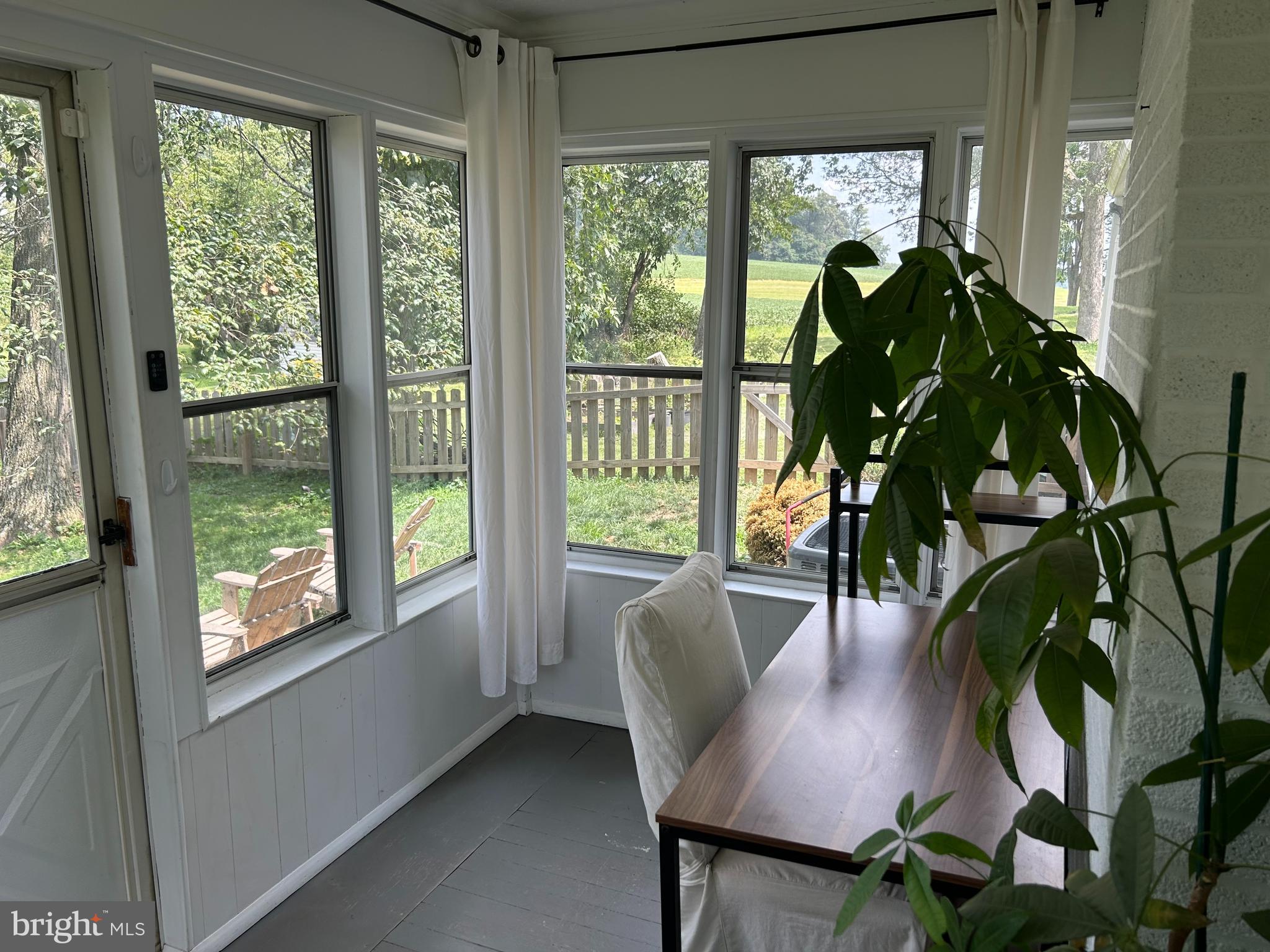 1175 Felton Road Red Lion, PA 17356 - Photo 8 of 16 a dining room with furniture potted plants and wooden floor