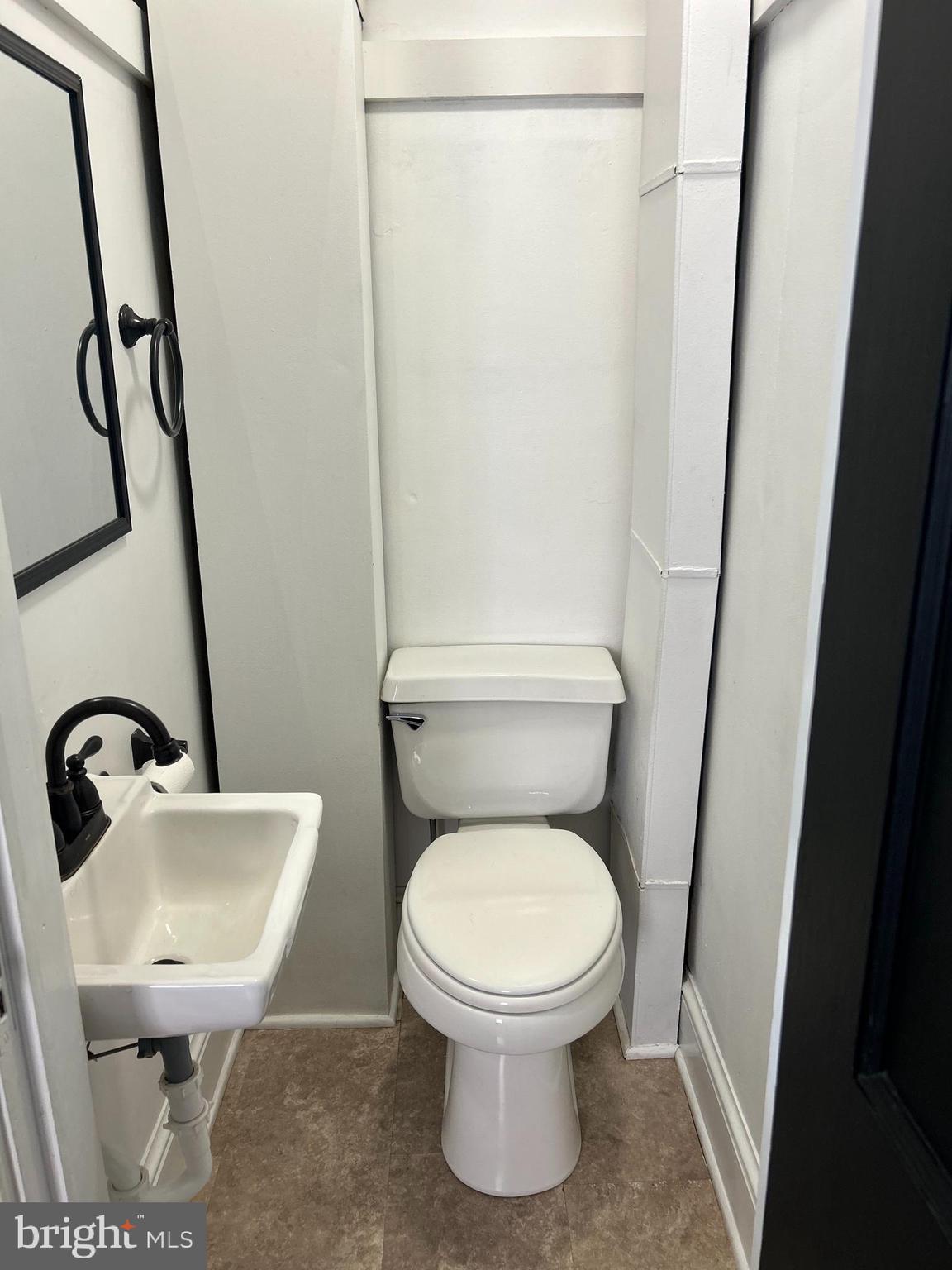 1175 Felton Road Red Lion, PA 17356 - Photo 9 of 16 a white toilet sitting next to a bathroom sink