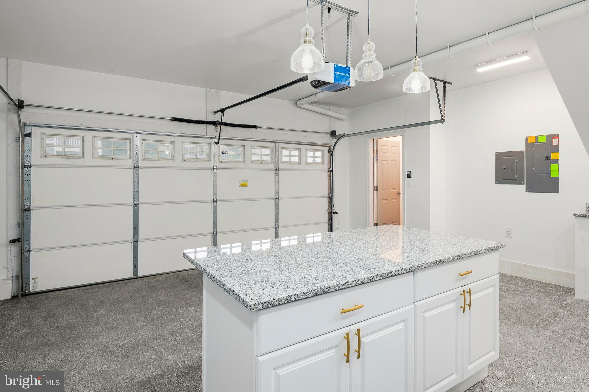 33 Greensborough Road Reisterstown, MD 21136 - Photo 9 of 40 a kitchen with kitchen island granite countertop a sink and a refrigerator