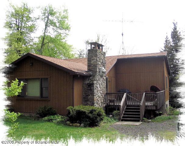 0 Spring Hill Road Sterling, PA 18463 - Photo 14 of 24 a front view of a house with garden