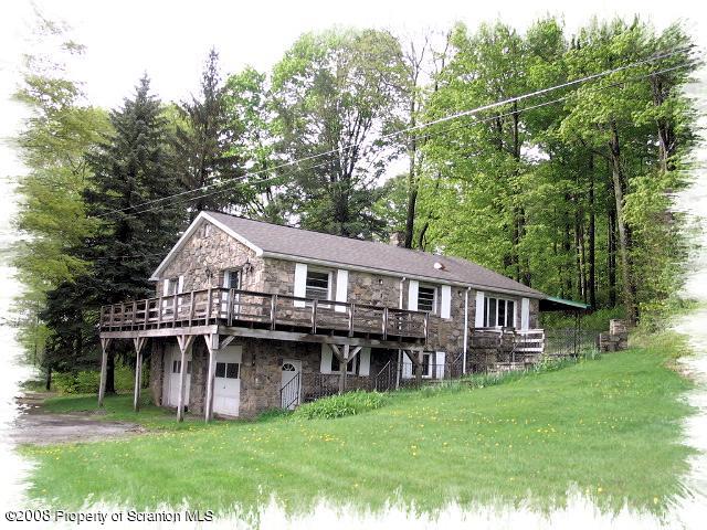 0 Spring Hill Road Sterling, PA 18463 - Photo 5 of 24 a view of a house with a big yard and large trees