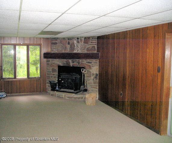 0 Spring Hill Road Sterling, PA 18463 - Photo 6 of 24 a living room with furniture and a fireplace