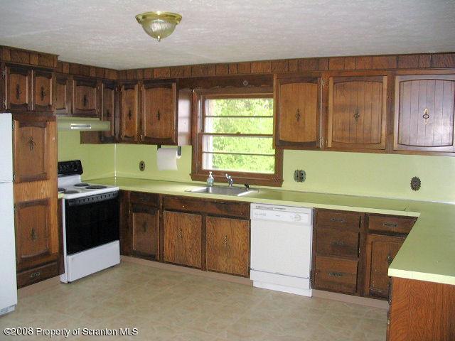 0 Spring Hill Road Sterling, PA 18463 - Photo 7 of 24 a kitchen with a sink and a stove top oven