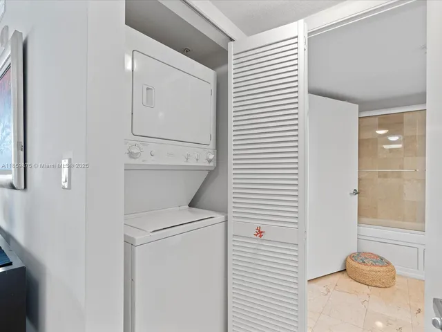 a bathroom with a washer and dryer