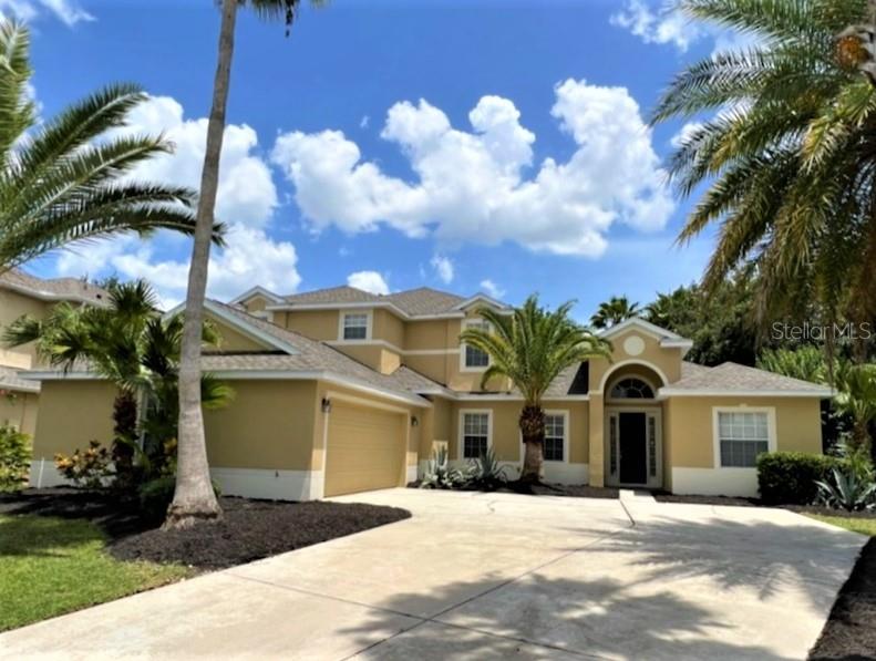 3469 Forest Ridge Lane Kissimmee, FL 34741 - Photo 1 of 1 a view of a white house with a yard