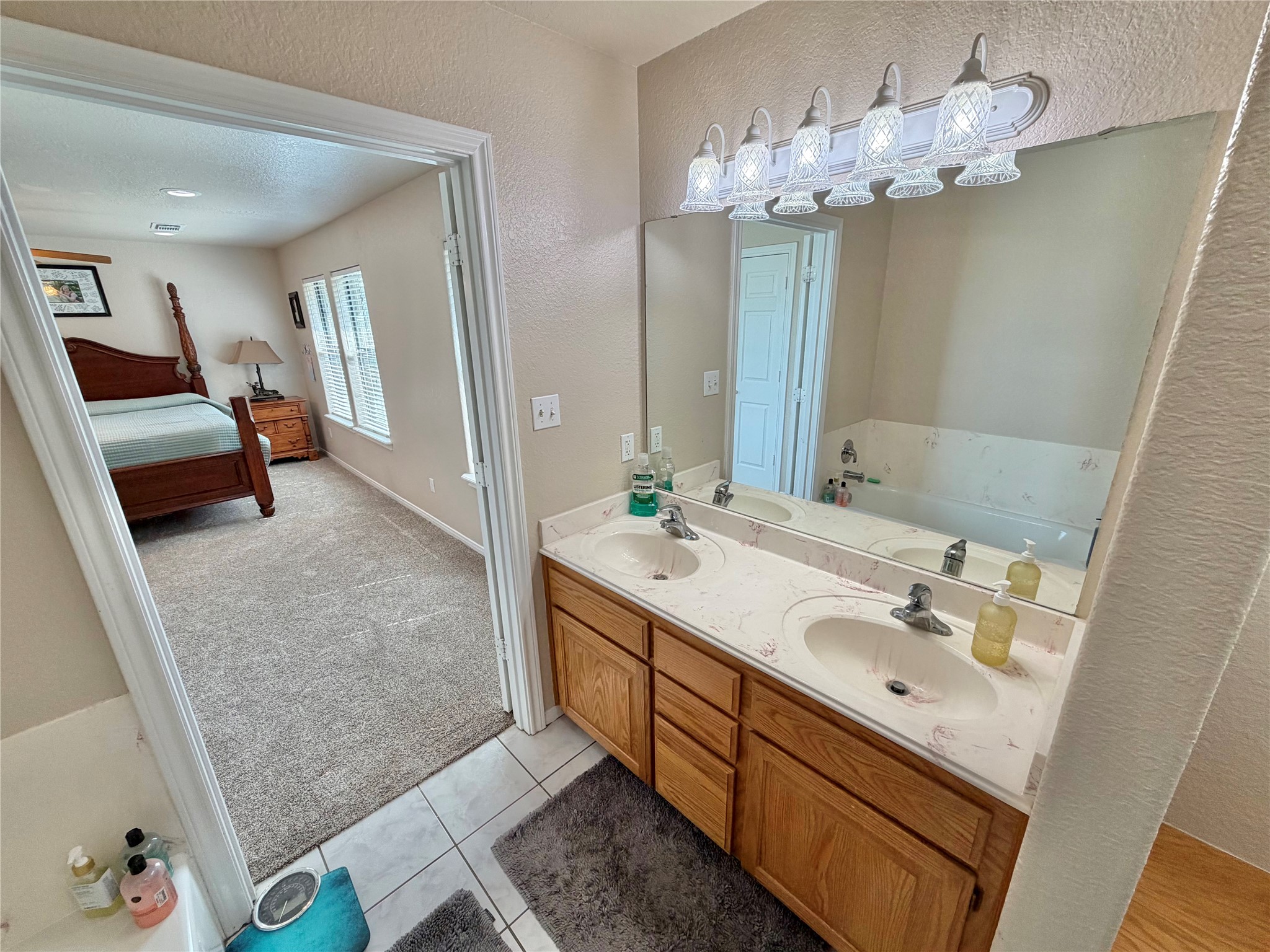 15903 County Road 621 Angleton, TX 77515 - Photo 22 of 33 a spacious bathroom with a double vanity sink mirror and shower
