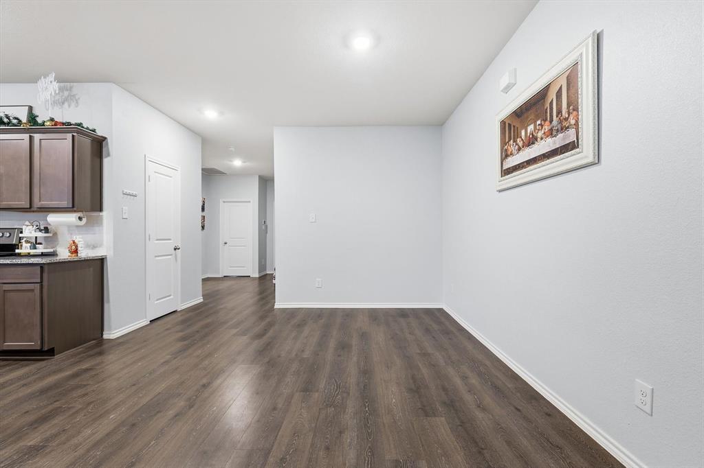 2416 Wildhaven Road Crandall, TX 75114 - Photo 10 of 35 a view of an empty room with wooden floor