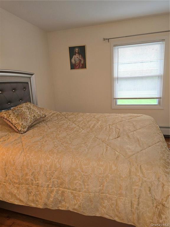 2115 State Rte 55, Unit 1 LaGrangeville, NY 12540 - Photo 11 of 23 a bedroom with a bed and window