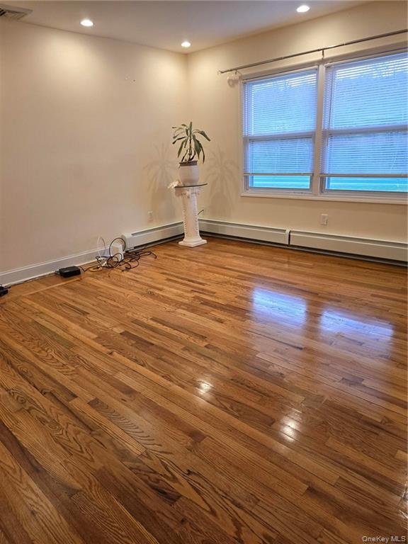 2115 State Rte 55, Unit 1 LaGrangeville, NY 12540 - Photo 13 of 23 an empty room with wooden floor and windows