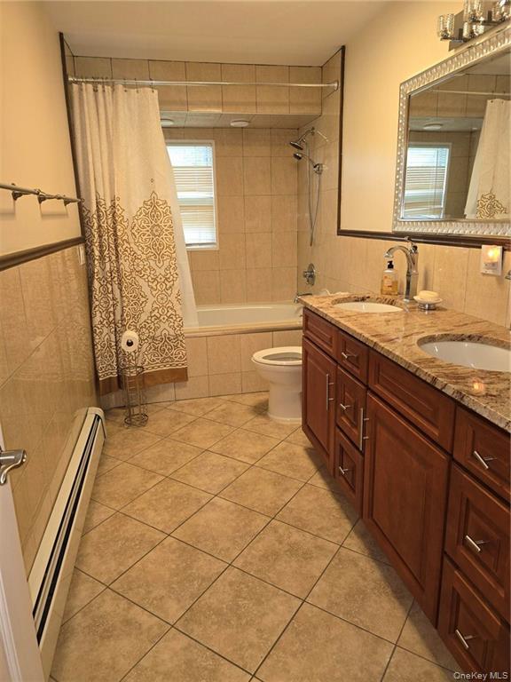 2115 State Rte 55, Unit 1 LaGrangeville, NY 12540 - Photo 18 of 23 a spacious bathroom with a granite countertop sink a toilet and a mirror
