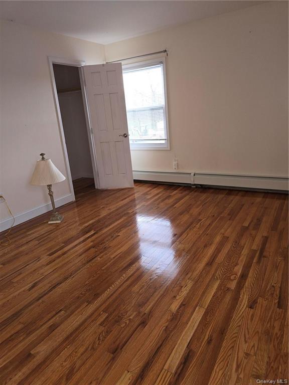 2115 State Rte 55, Unit 1 LaGrangeville, NY 12540 - Photo 20 of 23 a view of an empty room with wooden floor and a window