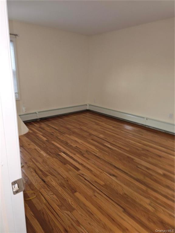 2115 State Rte 55, Unit 1 LaGrangeville, NY 12540 - Photo 21 of 23 a view of an empty room with wooden floor