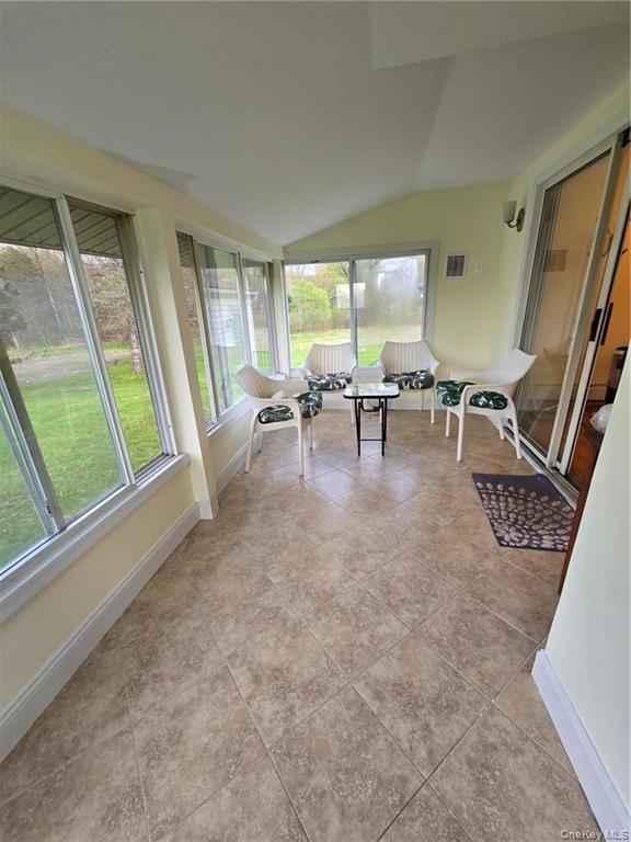 2115 State Rte 55, Unit 1 LaGrangeville, NY 12540 - Photo 22 of 23 a living room with furniture and a large window