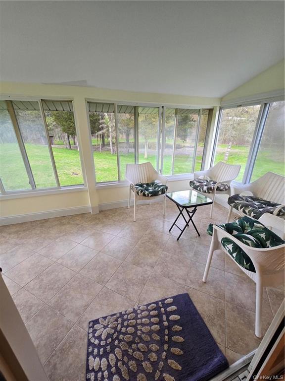 2115 State Rte 55, Unit 1 LaGrangeville, NY 12540 - Photo 23 of 23 a living room with furniture and a fireplace