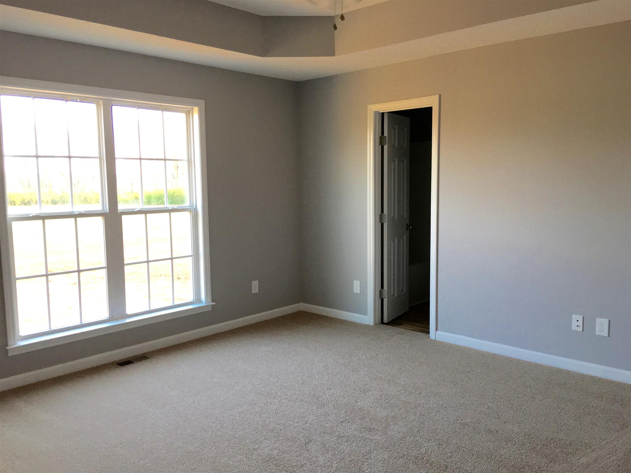 85 Wells Lee Road Flintville, TN 37335 - Photo 8 of 13 Double framed windows in master bedroom. Master separate from other bedrooms.