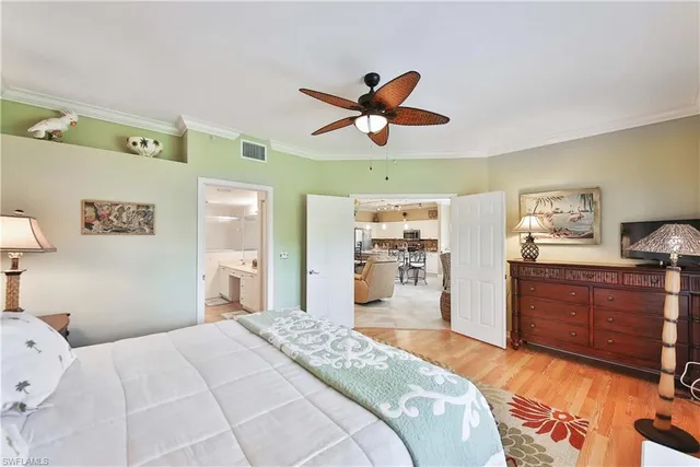 a bedroom with a bed and a dresser in it