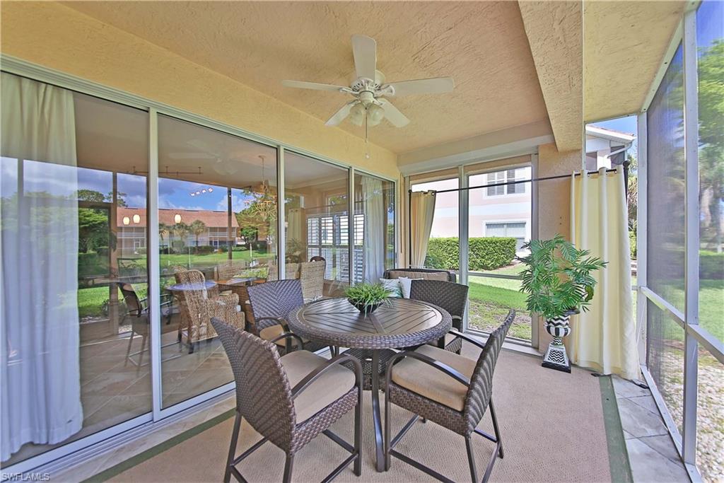5105 Cedar Springs Drive, Unit 101 Naples, FL 34110 - Photo 19 of 30 a view of a dining room with furniture window and outside view