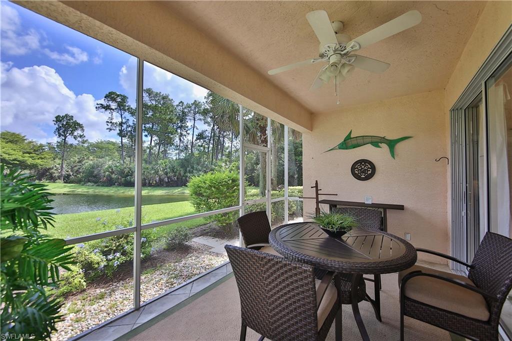 5105 Cedar Springs Drive, Unit 101 Naples, FL 34110 - Photo 23 of 30 a view of a porch with furniture and a yard