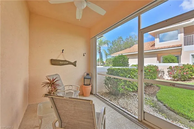 a view of a living room and a floor to ceiling window