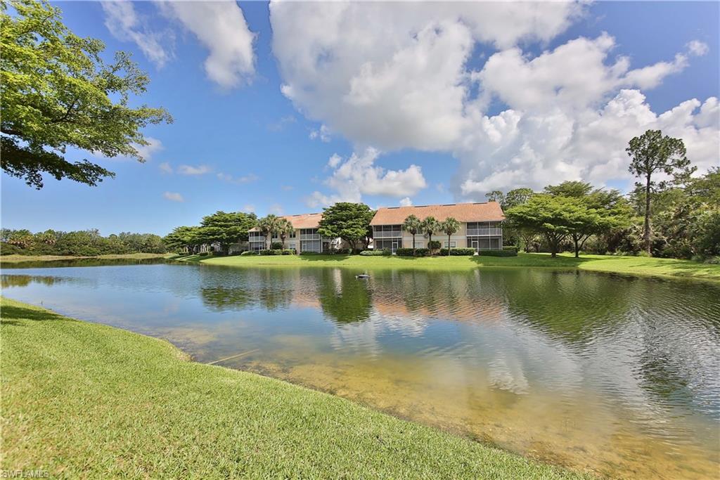 5105 Cedar Springs Drive, Unit 101 Naples, FL 34110 - Photo 29 of 30 a view of a lake