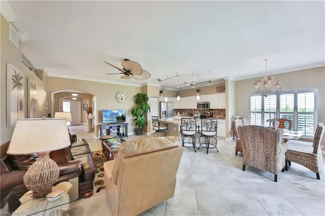 a living room with lots of furniture and white walls