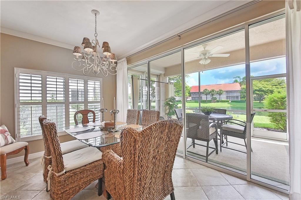 5105 Cedar Springs Drive, Unit 101 Naples, FL 34110 - Photo 10 of 30 a view of a dining room with furniture window and outside view