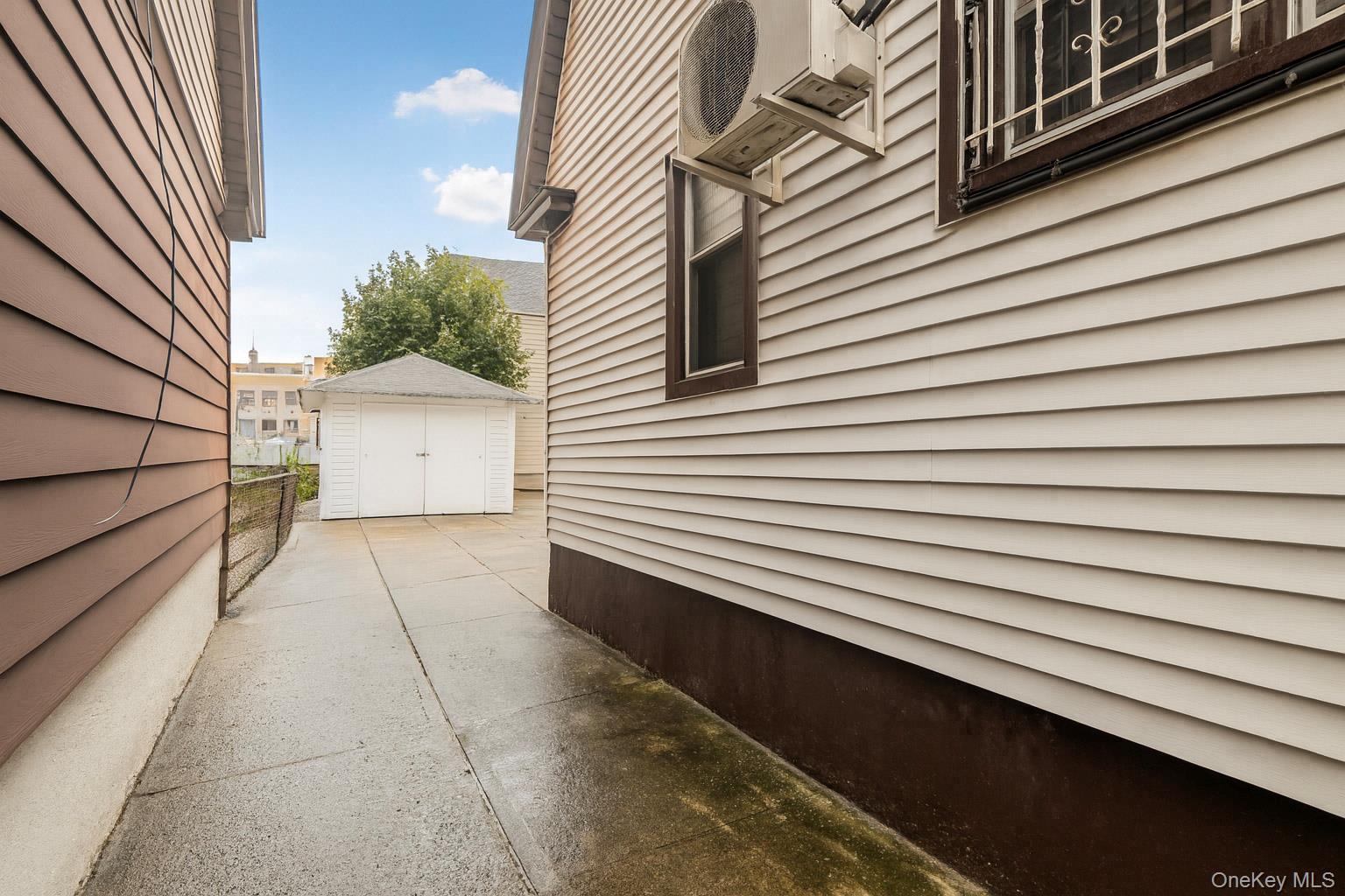 90-06 107th Avenue Queens, NY 11417 - Photo 11 of 13 a view of a back yard of the house