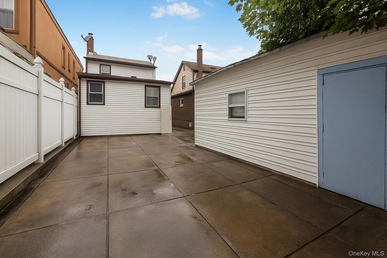 90-06 107th Avenue Queens, NY 11417 - Photo 10 of 13 a view of a house with a garage