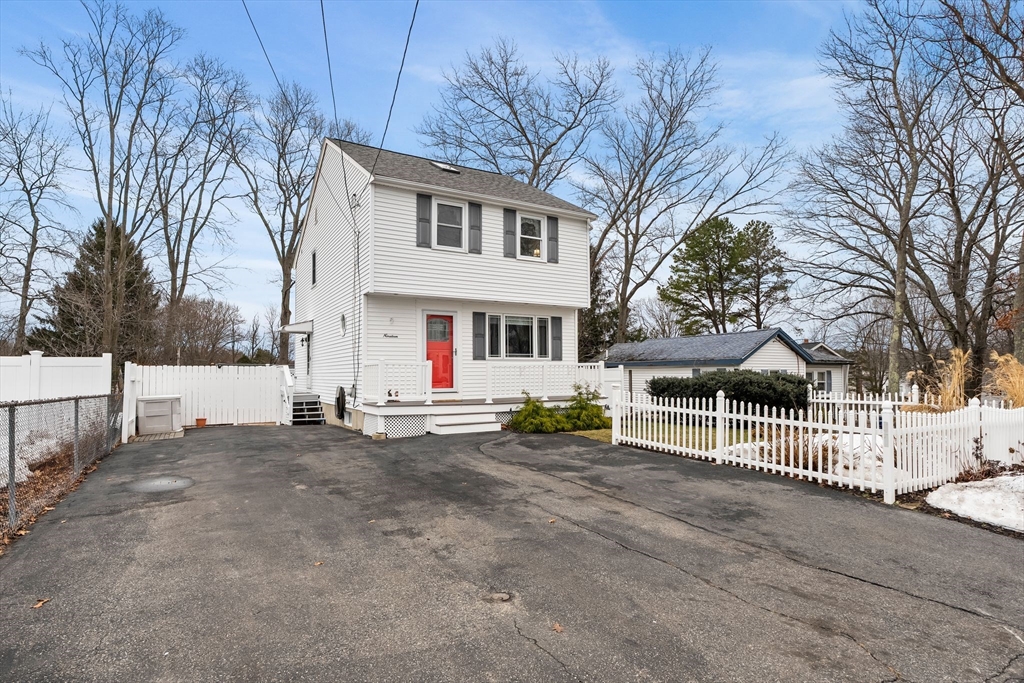 19 Overlook Road Holbrook, MA 02343 - Photo 2 of 42 a view of a white house with a large tree and wooden fence